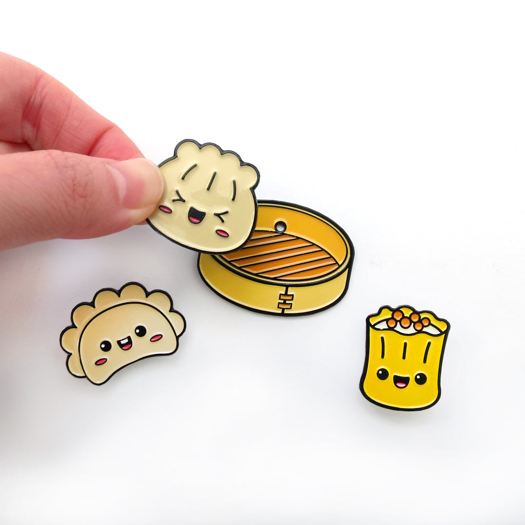 Dim Sum enamel pin set on white background