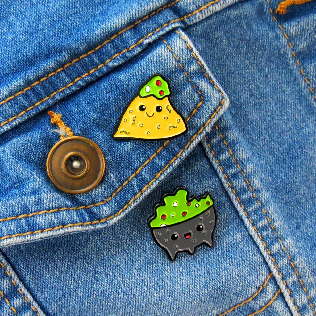 Chip and Guac enamel pins on jean jacket pocket