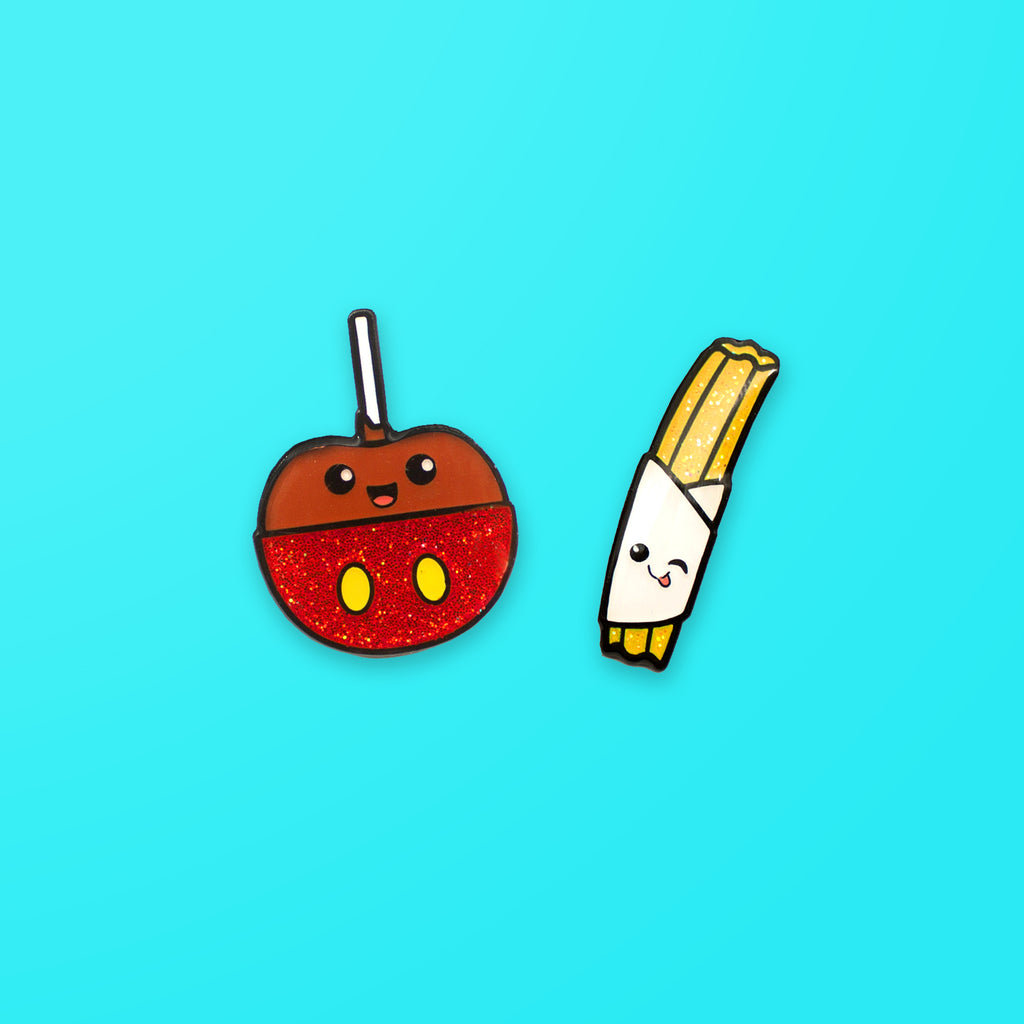 Caramel Apple and Churro enamel pin set on blue background