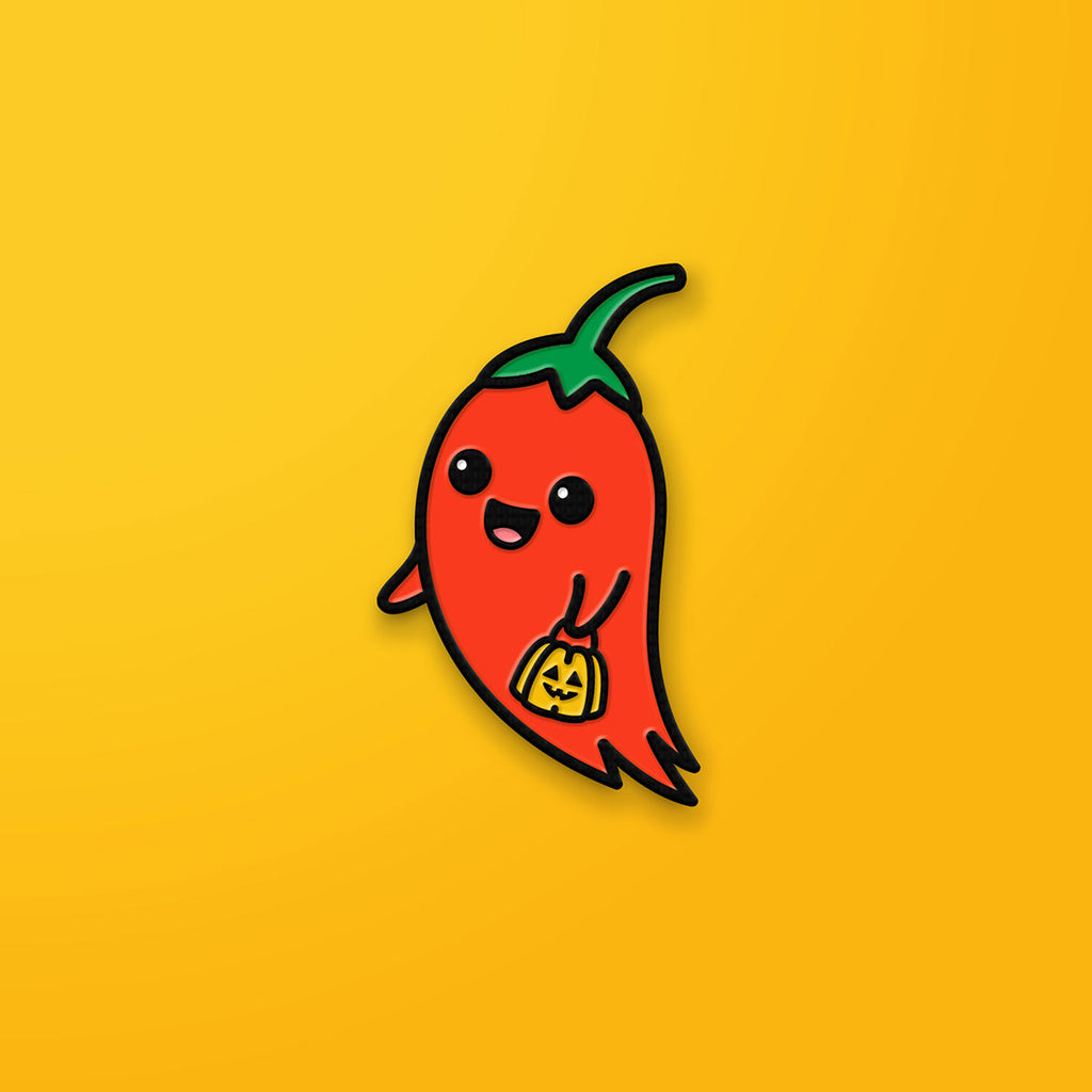 Ghost Pepper enamel pin on orange background