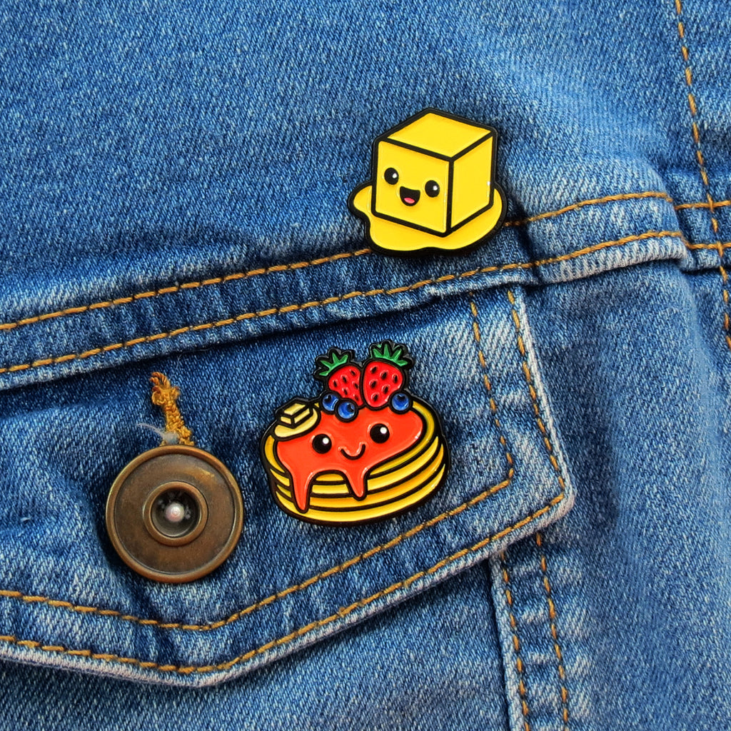 Pancake and Butter enamel pins on jean jacket pocket