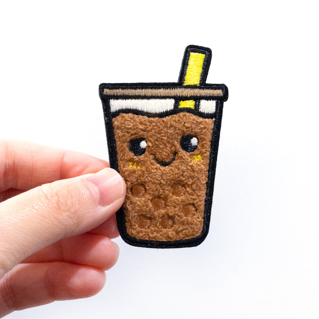 Hand holding Boba Milk Tea iron on patch