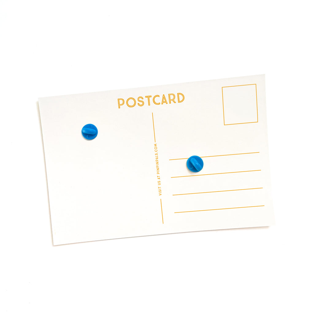 White Camera and Plane Enamel Pins - Back of Postcard