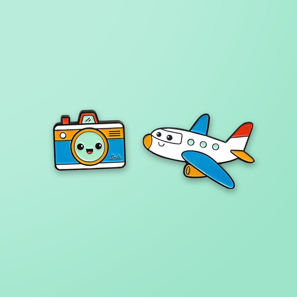 White Camera and Plane Enamel Pins