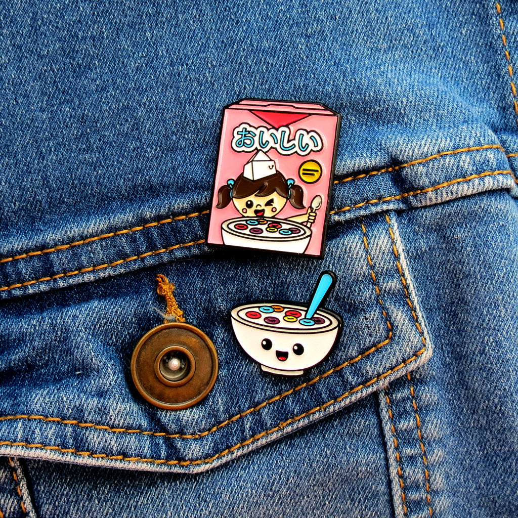 Fruity Cereal Box and Cereal Bowl enamel pins on jean jacket pocket