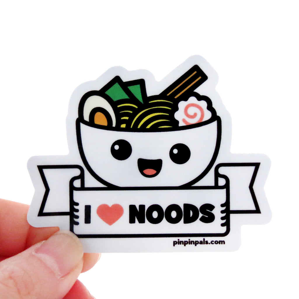 Hand holding a I Love Noods vinyl sticker